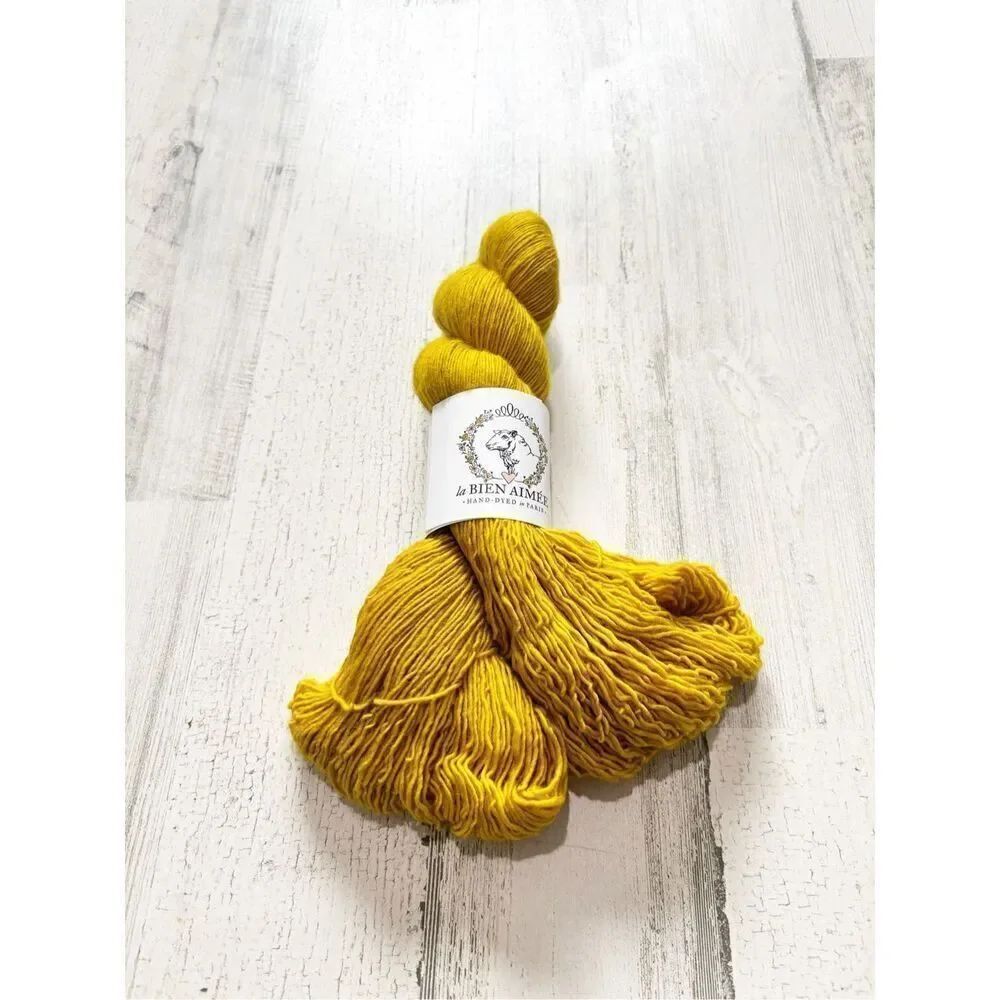 La Bien Aimée Merino Singles yarn in the colorway "Yellow Brick Road"